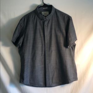 Grey button down penguin shirt.